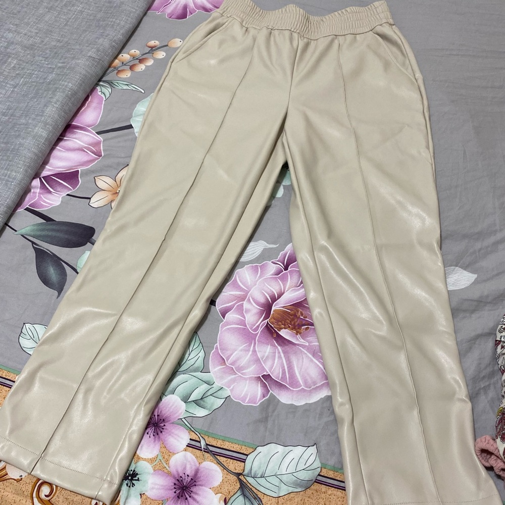 Cream leather pants.